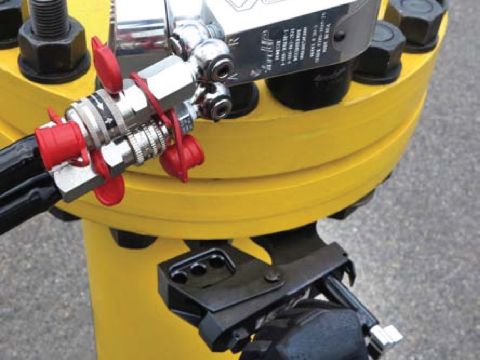 TBW against the nut, with a hydraulic wrench on the other side